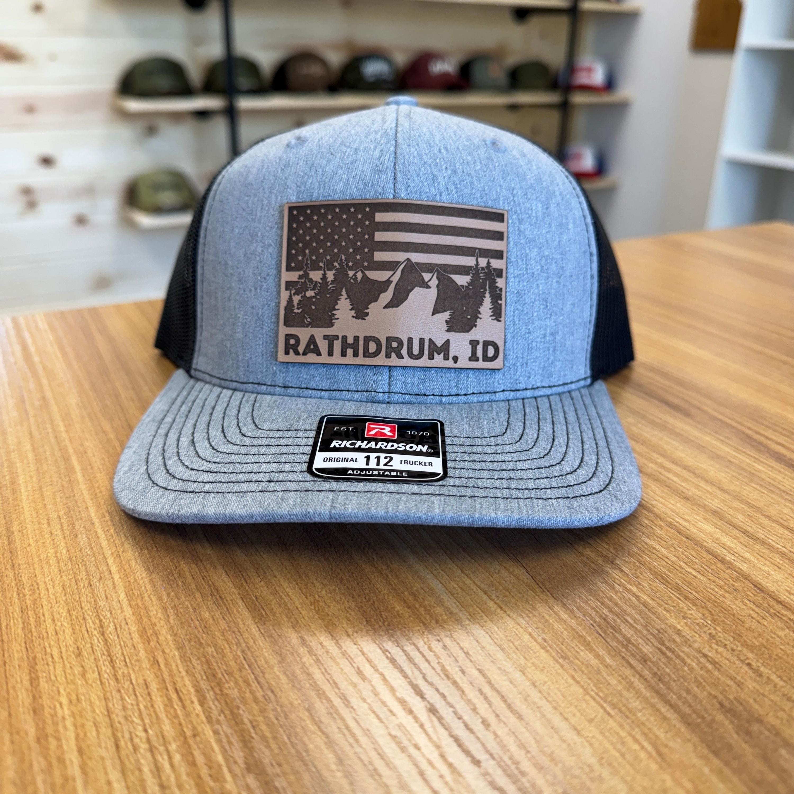 Rathdrum Idaho Flag Mountain Leather Patch Hat Trucker with Mesh Back-208 Tees Wholesale, Idaho