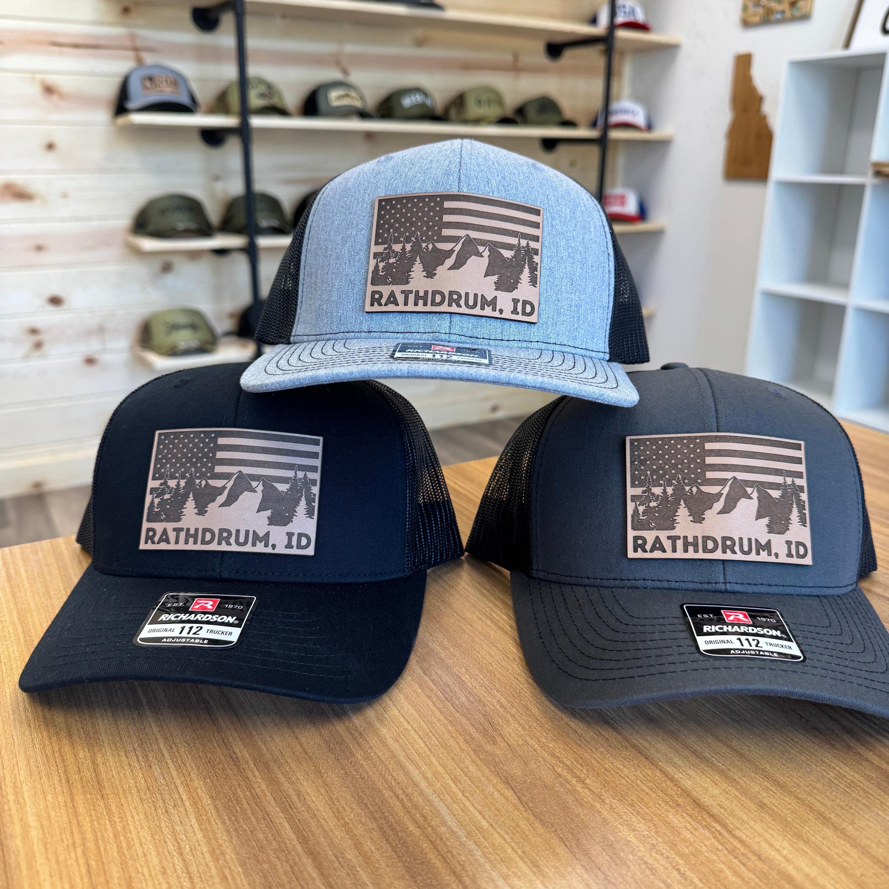Rathdrum Idaho Flag Mountain Leather Patch Hat Trucker with Mesh Back-208 Tees Wholesale, Idaho